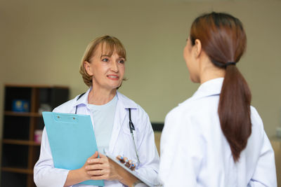 Female doctors talking at hospital