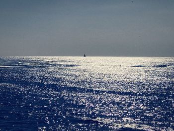 Scenic view of sea against sky at sunset