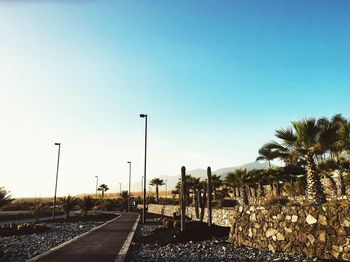 Road against clear blue sky