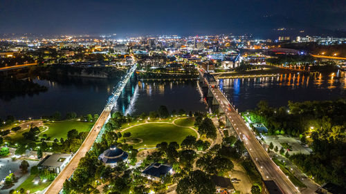 High angle view of illuminated buildings in city at night