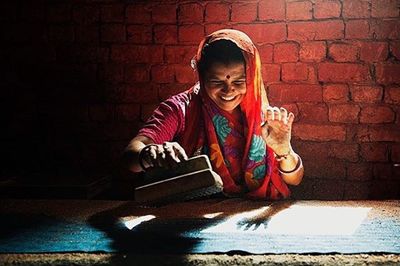 Portrait of a young man sitting on bench