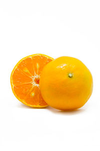 Close-up of oranges against white background