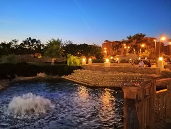 View of canal against clear sky at night