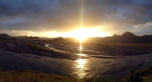 Scenic view of landscape against sky during sunset