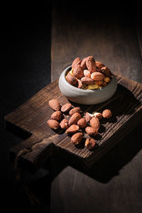 Almond high level angle on brown wooden board