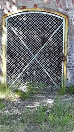 Old metal fence against wall