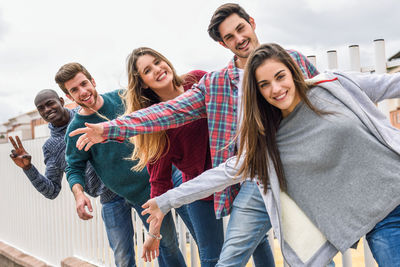 Portrait of smiling friends enjoying outdoor