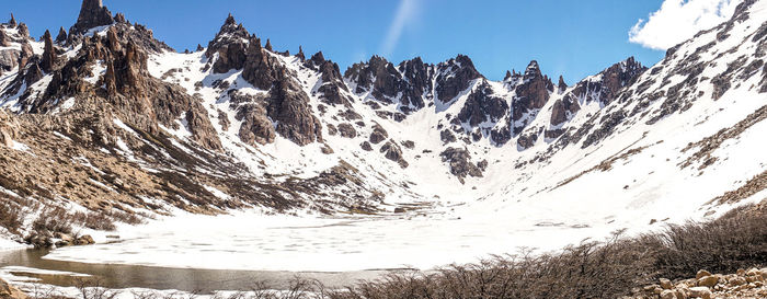 Scenic view of snowcapped mountains against sky