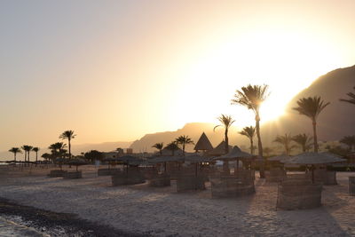 View of swimming pool at sunset