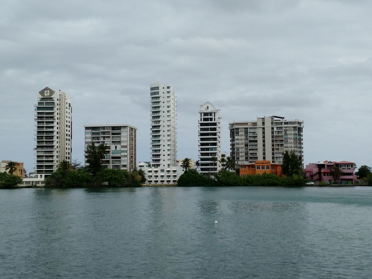 building exterior, architecture, built structure, city, water, waterfront, sky, skyscraper, river, cityscape, cloud - sky, modern, urban skyline, tall - high, office building, building, tower, residential building, cloud, reflection