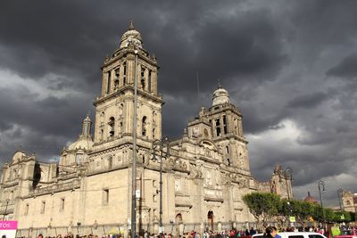 Low angle view of church against cloudy sky