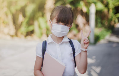 Portrait of boy standing outdoors