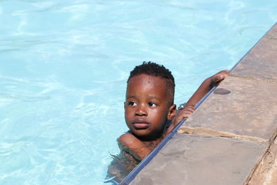 High angle portrait of boy in swimming pool