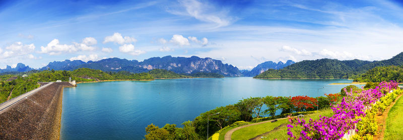 Scenic view of lake and mountains against sky