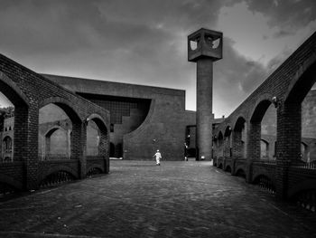 Lonely muslim walking towards mosque