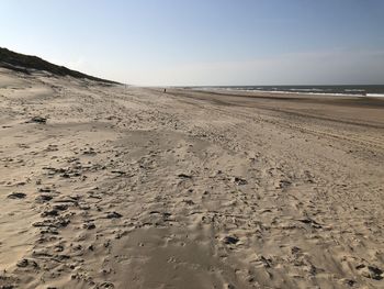 Scenic view of beach against clear sky