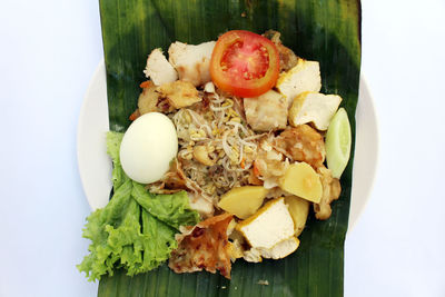 High angle view of chopped fruits in plate