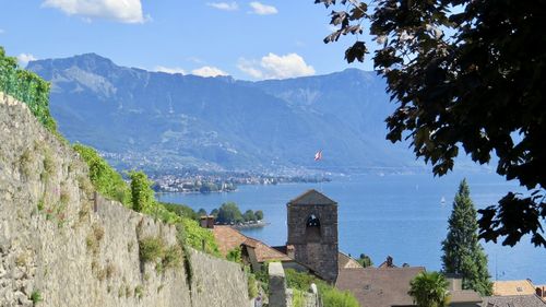 Panoramic view of sea and buildings against sky