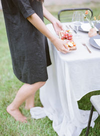 Low section of woman holding food