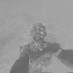 High angle view of man swimming in pool