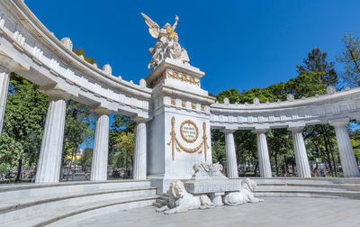 Statue of historic building against sky