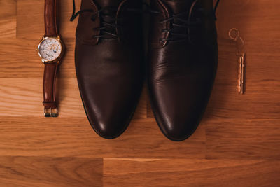 High angle view of shoes on hardwood floor