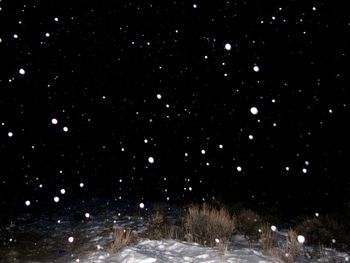 View of snow covered landscape at night