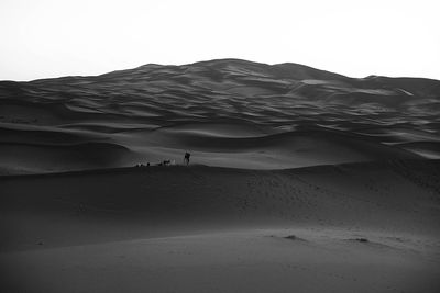 Scenic view of desert against clear sky