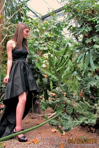 Woman standing by plants