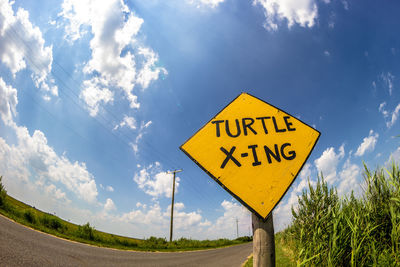 Information sign against blue sky