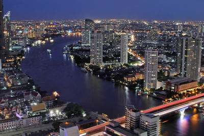 High angle view of illuminated city buildings at night