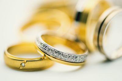 Close-up of wedding rings on table