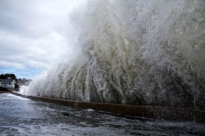 Waves crashing creating a wall of water 