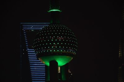 Low angle view of illuminated building at night