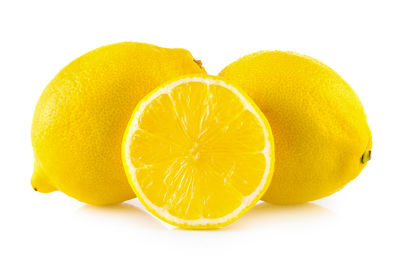 Close-up of lemon slice against white background