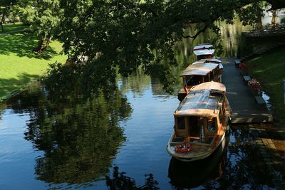 Boats moored in river