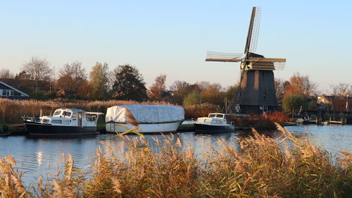 Ship in lake against clear sky