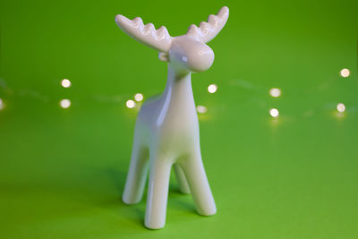Close-up of figurine against blue background
