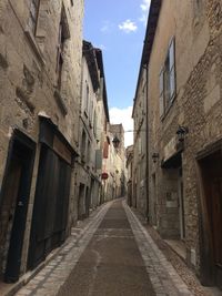 Footpath amidst buildings