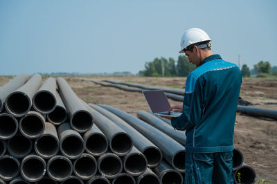 Rear view of engineer working at construction site