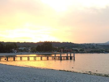 Scenic view of lake at sunset