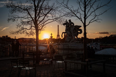 Silhouette of people at sunset