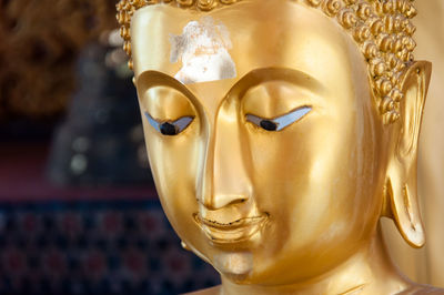 Close-up of buddha statue in temple