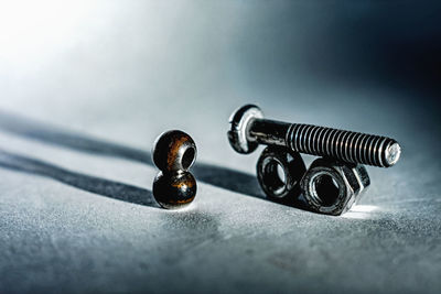 High angle view of nuts and bolt against white background