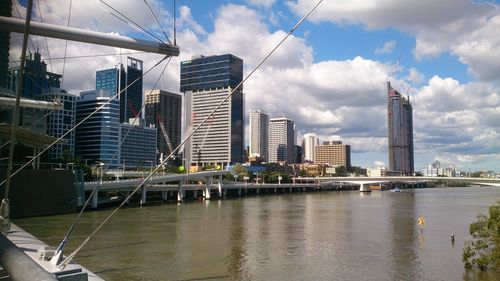 Cityscape against cloudy sky