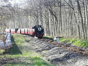 Train on railroad track against sky