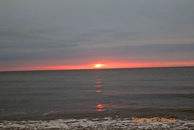 Scenic view of sea against sky at sunset