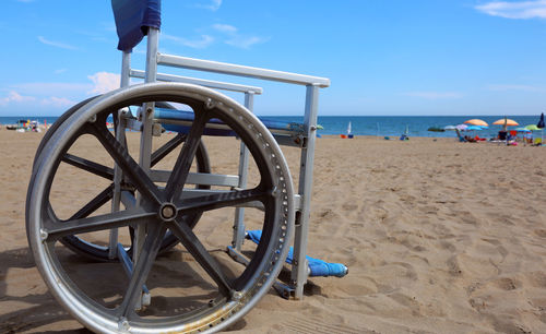 Lifeguard hut on beach against sky