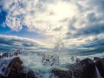 Scenic view of sea against cloudy sky