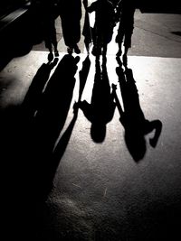 Low section of people walking on road